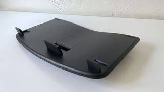 The bottom of the HP 960 Ergonomic Keyboard with height adjustment feet extended