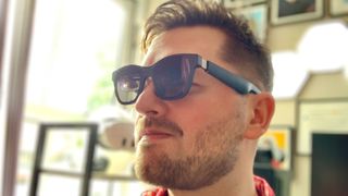 Person wearing XREAL Air 2 AR smart glasses