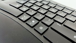 Close up of the dedicated Copilot AI key on the HP 960 Ergonomic Wireless Keyboard